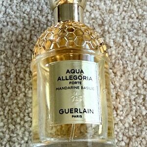 Guerlain Eau de Parfum Bottle.  1/4th of the bottle has been used.